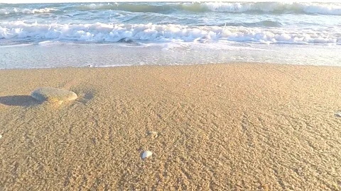 Slow Motion Wave Hits the Sand And Goes Under the Shot Stock-Footage 87905299