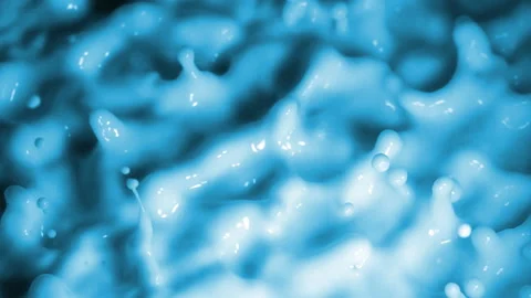 Slow Motion: Wave Motion of a viscous fluid surface when excited by vibration Stock Footage 124528841