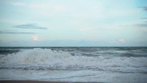 Slow motion wave move into the shore in the morning Stockbeeldmateriaal 86276872