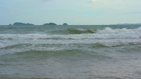 Slow motion wave sea on beach of shore in Thailand on blue sky background Stock Footage 114692154