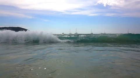 Slow motion wave sea on sand beach on sunset beauty Vidéo 83474203