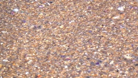 Slow motion wave sea on sand and stone Stock Footage 83604097