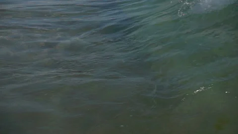 Slow motion wave with splashes on the water surface. Stock Footage 112942241