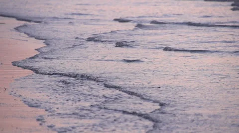 Slow motion waves after sunset Stock Footage 26947590
