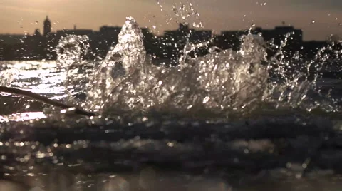 Slow Motion Waves and Small City Skyline. Stock-Footage 60933169