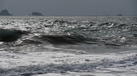 Slow motion waves, backlit by winter sun, Cornwall, UK Stock Footage 56138980