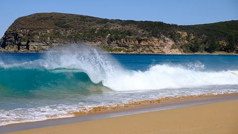 Slow motion waves breaking on to a beautiful clean Australian beach Stock Footage 93723796