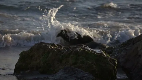 Slow Motion Waves Breaking Over Rocky Coastline Stock Footage 78211112