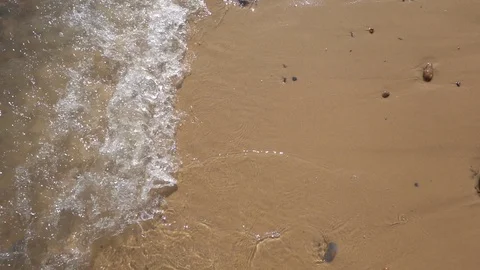 Slow motion waves breaking on the sand Stock Footage 115958438