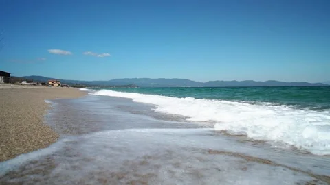 Slow Motion Waves breaking on Sandy Beach in Greece Stock Footage 197441086