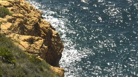 Slow Motion Waves Breaking On Sea Cliffs Seen From Above - Subtropical Seascape Stock Footage 109227781