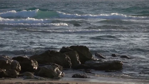Slow Motion Waves Breaking Off the Shoreline Stock Footage 78211098