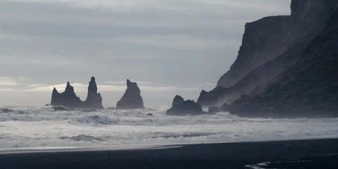 Slow motion waves by cliffs (Reynisdrangar) at black beach, Reynisfjara, Iceland Stock Footage 122914147