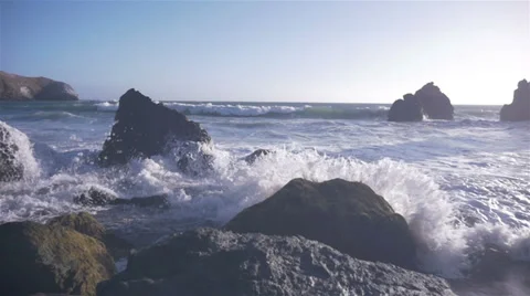 Slow motion waves crash against rocks 3 Video stock 39729163