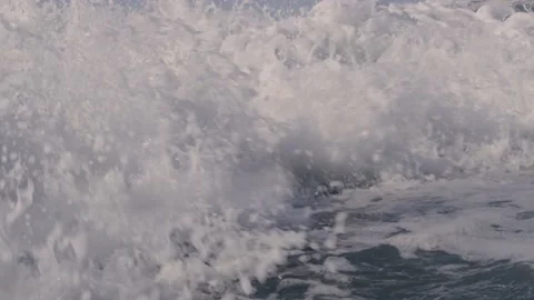 Slow motion waves crash and foam in close up shot and then cover the camera Stock Footage 147743978