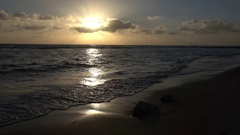 Slow Motion Waves Crashing on Beach Under Brilliant Sunset Stock Footage 78211556