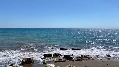 Slow motion of waves crashing on the beach. Sea waves splashing on the coastline Stock Footage 200930442