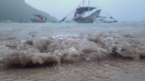 Slow Motion Waves Crashing In Beach While Raining Video stock 228850786