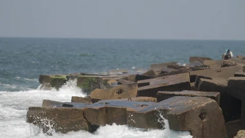 Slow motion of waves crashing on a cement breakwater Egypt Stock Footage 90926438