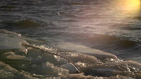 Slow Motion Waves Crashing into Ice on Shore. Stock Footage 60934085