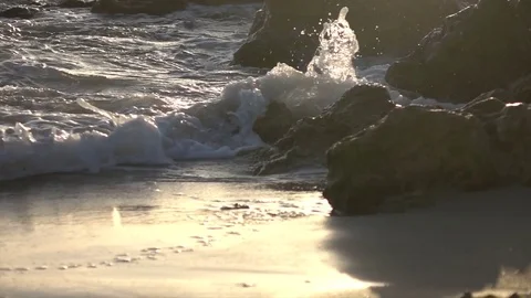 Slow Motion Waves Crashing in Light From Golden Sunset Stock Footage 78211450