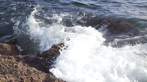 Slow Motion Waves Crashing on Rocks Stock Footage 55299136