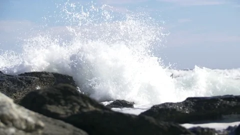 Slow Motion Waves Crashing Into Rocks Video stock 79074336