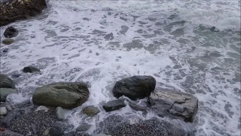 Slow motion waves crashing on rocks Stock Footage 81617598