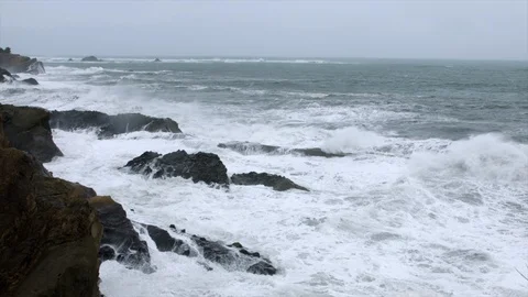 Slow motion waves crashing on rocks Stock Footage 129632269