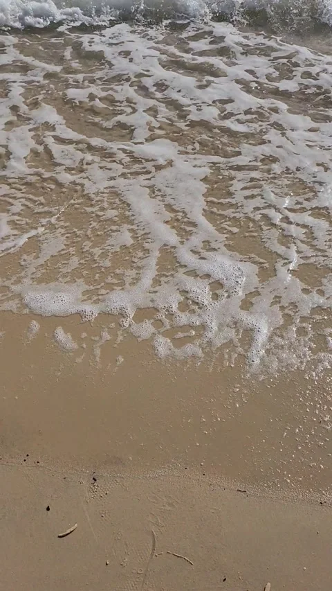 Slow Motion Waves Crashing on Sand at Beach Edge Close Up Stock Footage 340168876