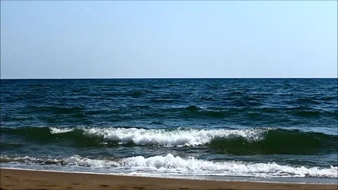 Slow Motion Waves Crashing on Sandy Beach Stock Footage 310429762