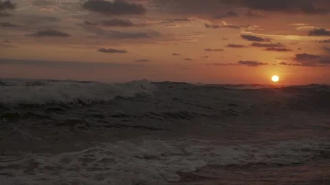 Slow motion Waves Crashing on Sunset Time Video stock 148891481