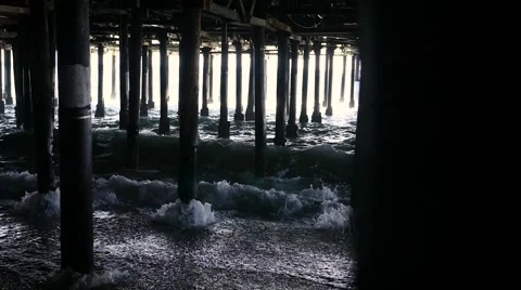 Slow Motion Waves Crashing Under Pier Vídeos de archivo 64411468