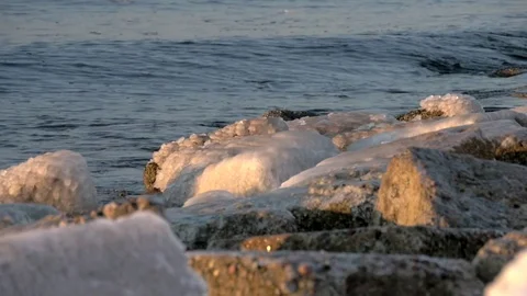 Slow motion of waves crushing during a winter in the Baltic Sea, Video stock 73380147