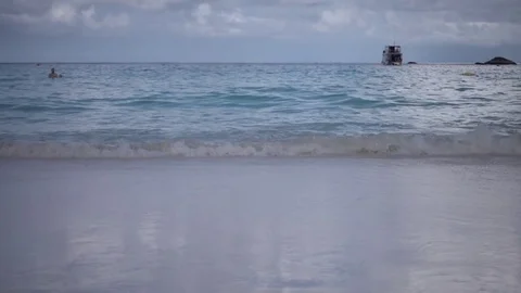 Slow-motion waves gently crashing on shore Stock Footage 82986638