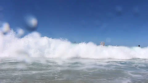 Slow motion waves hit camera (4) Stock Footage 22607837
