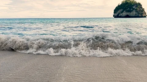 Slow motion of waves hitting shore in Diamond Beach,Nusa Penida East Island Stock Footage 125842806
