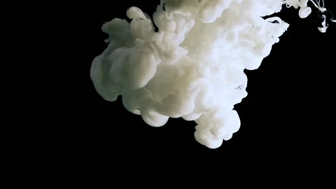 Slow motion of waves of milky ink and a splash of droplets Video stock 160411470