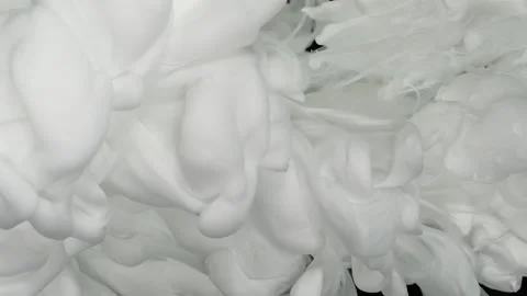 Slow motion of waves of milky ink. Screensaver. Video stock 164763329
