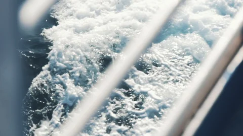 Slow motion of waves outside moving boat Stock Footage 105267030