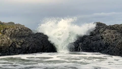 Slow motion Waves over rocks Stock Footage 230133946
