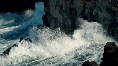 Slow motion waves pound Canary Islands shoreline Stock Footage 331075939