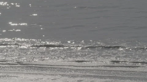 Slow motion waves with reflection of the sun - high angle Stock Footage 169649116