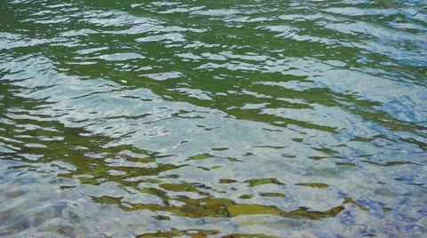 Slow Motion Waves Ripple and Break Over Waters Surface Stock Footage 66524669