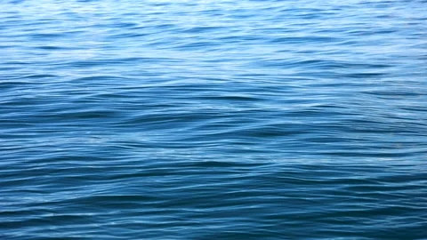 Slow motion of the waves with ripples on the blue water surface of the deep sea Stock Footage 235722162