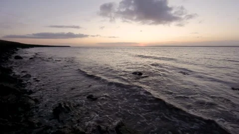 Slow motion waves roll in at Gold Cliff, Wales UK. Stock Footage 307002240