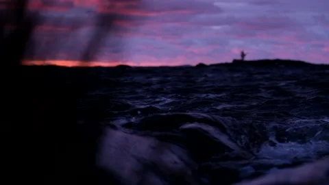 Slow motion waves rolling in during sunset Video stock 174775272