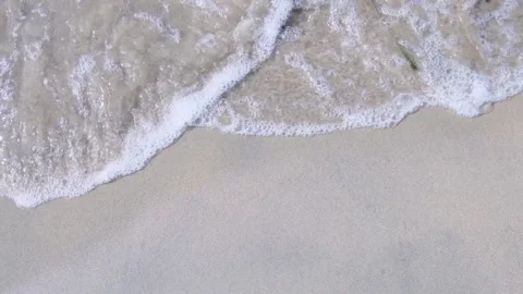 Slow motion, waves run over the sandy seashore, bright sunny day on vacation Stock Footage 161445409