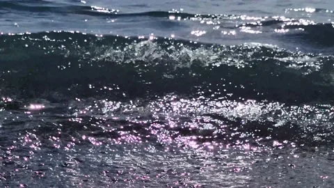 Slow motion of waves rushing towards the shore. As the waves move. Stock Footage 197143294