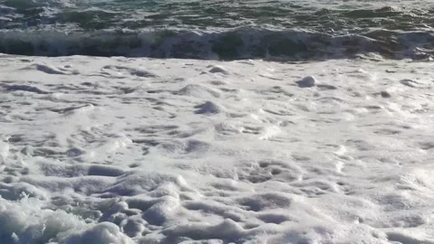  Slow motion of waves rushing towards the shore. Stock Footage 197143432